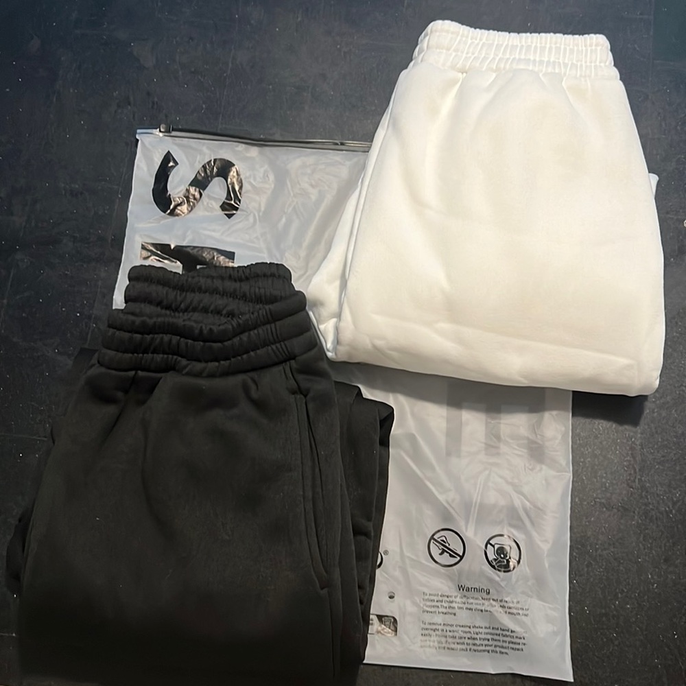 Sweatpants, black pair and white pair, brand new, never worn.
